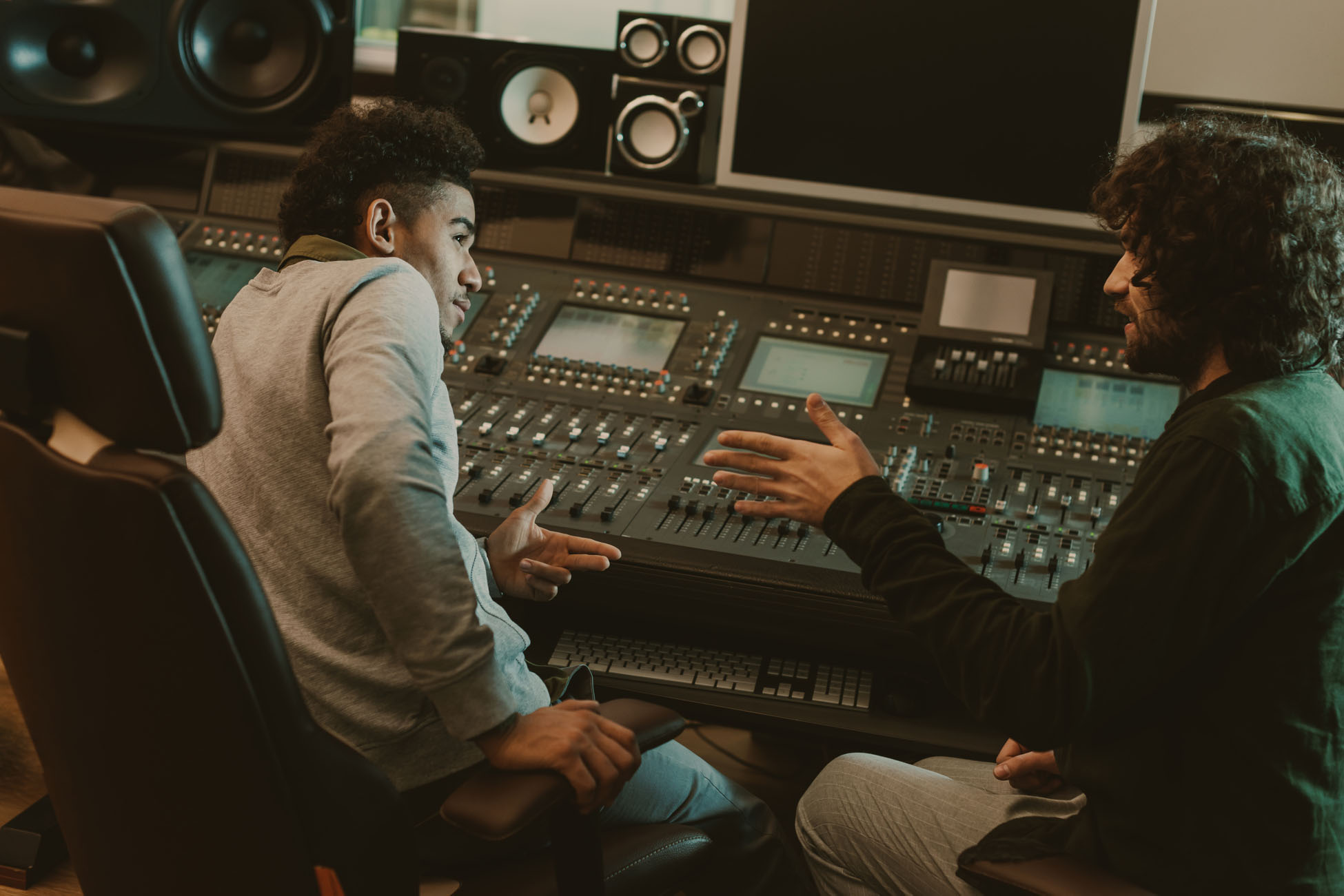 young musicians talking at recording studio young musicians talking at recording studio